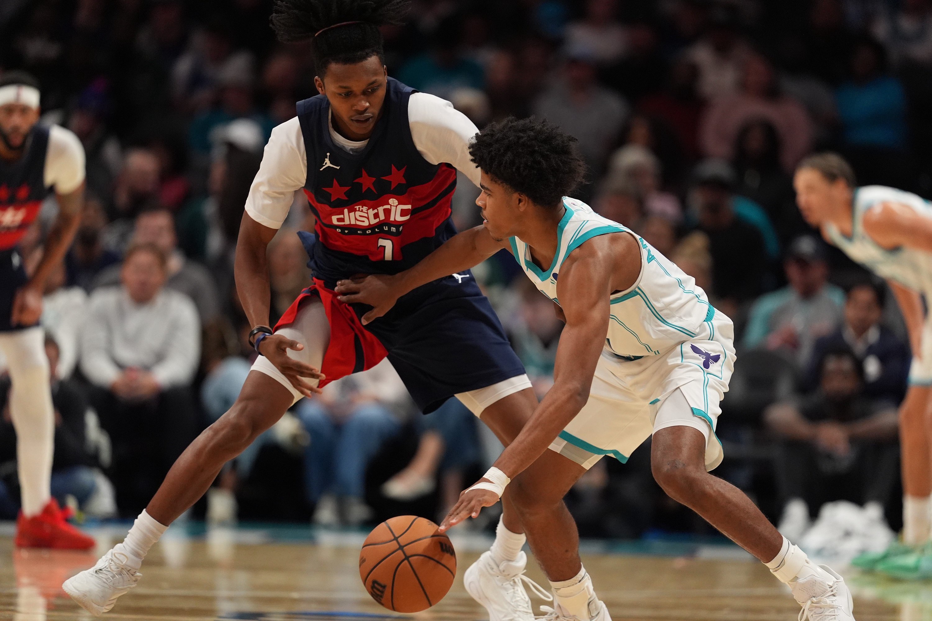 Oct 26, 2026; Charlotte, North Carolina, USA;  Charlotte Hornets guard Christian Anderson (5) is pressured by  Washington Wizards guard Bub Carrington (7)  during the second half at the Spectrum Center.  Mandatory Credit: Jim Dedmon-Imagn Images