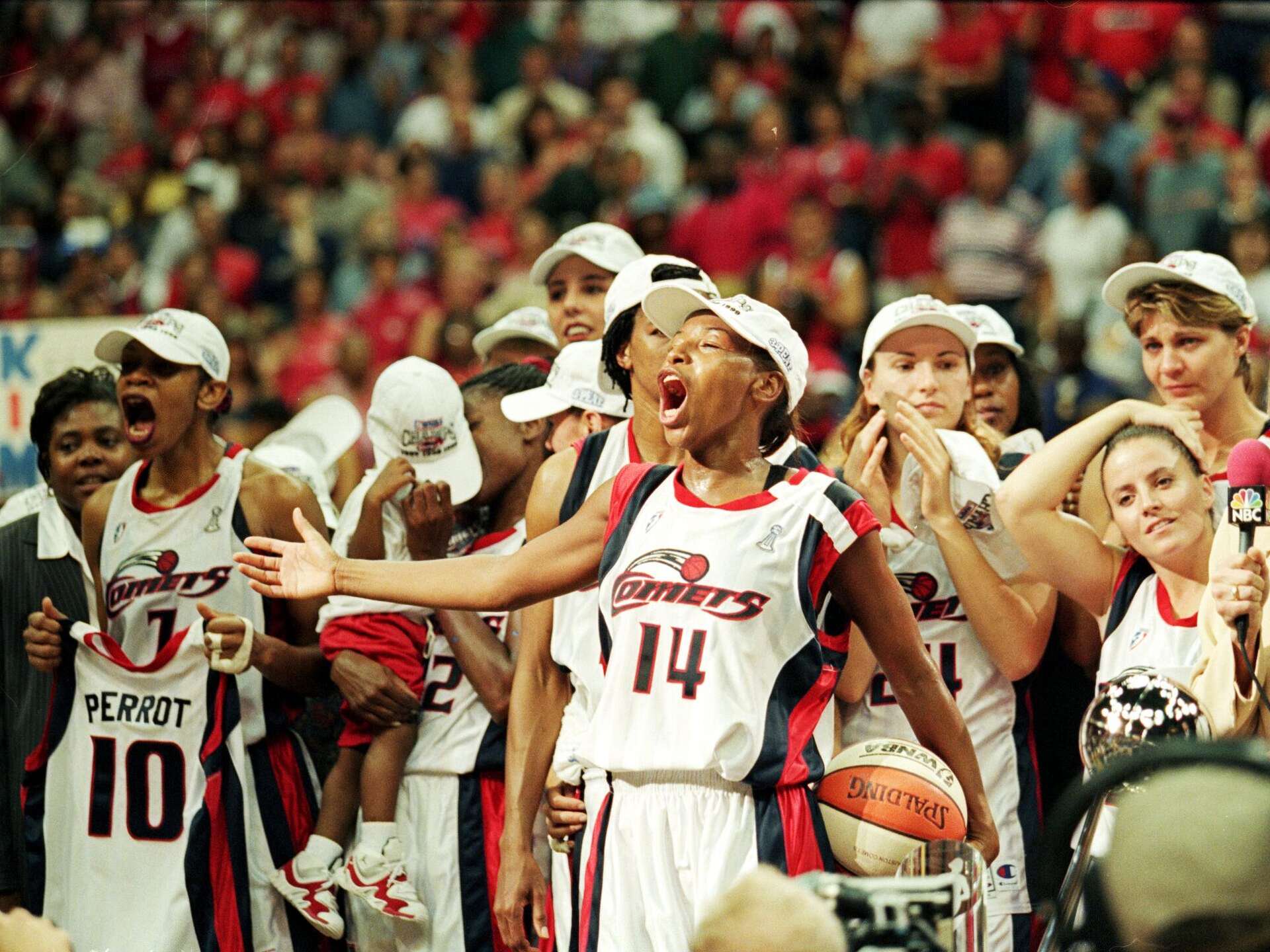 Cynthia Cooper #14 of the Houston Comets yells in celebration on the court after winning game three of the WNBA Finals against the New York Liberty at the Compaq Center in Houston, Texas on 5 Sep 1999.