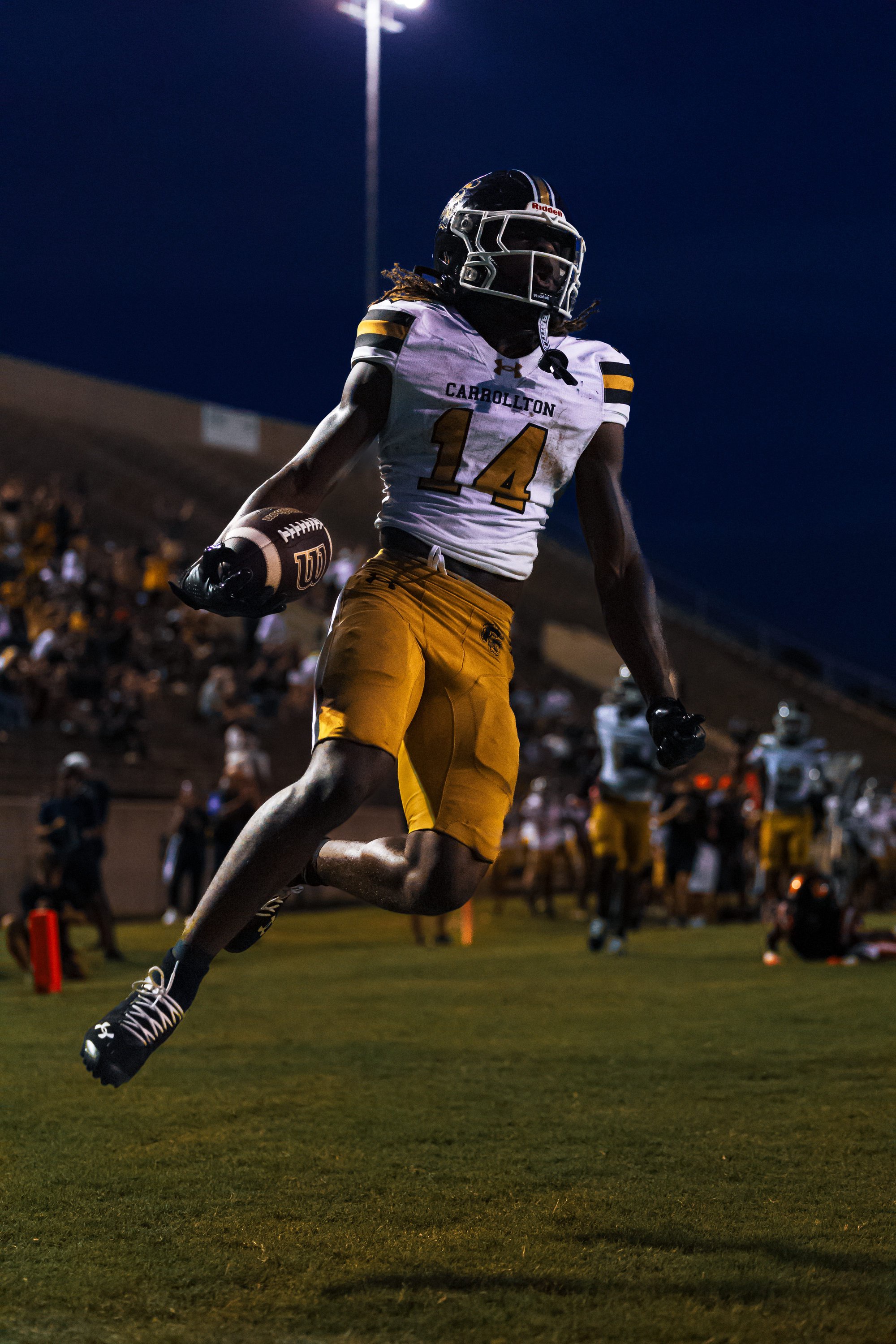 Carrollton (GA) sophomore running back Zach Watts celebrates a touchdown during a game.