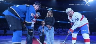 Hero hockey fan blocks out-of-play puck from hitting 4-year-old boy