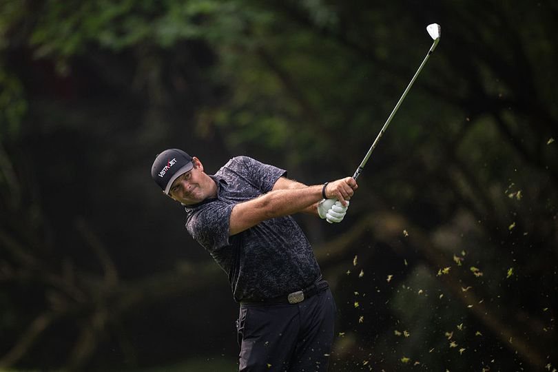 Patrick Reed hits an iron shot