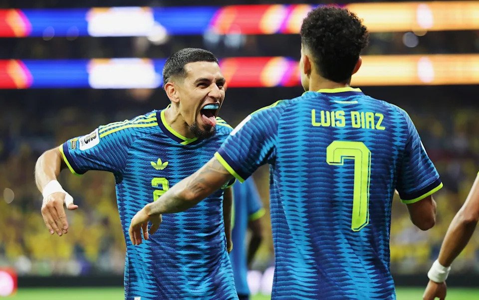 Daniel Munoz celebrates with Luis Diaz after scoring