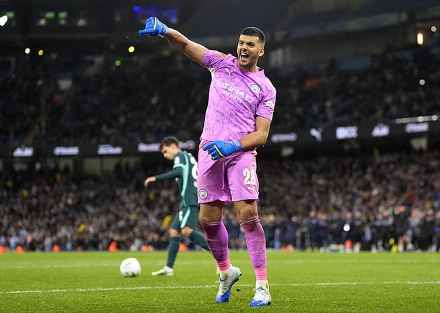 Manchester City keeper Geronimo Rulli celebrates saving a penalty in the shoot-out win over Brighton in the Carabao Cup (Nick Potts/PA).