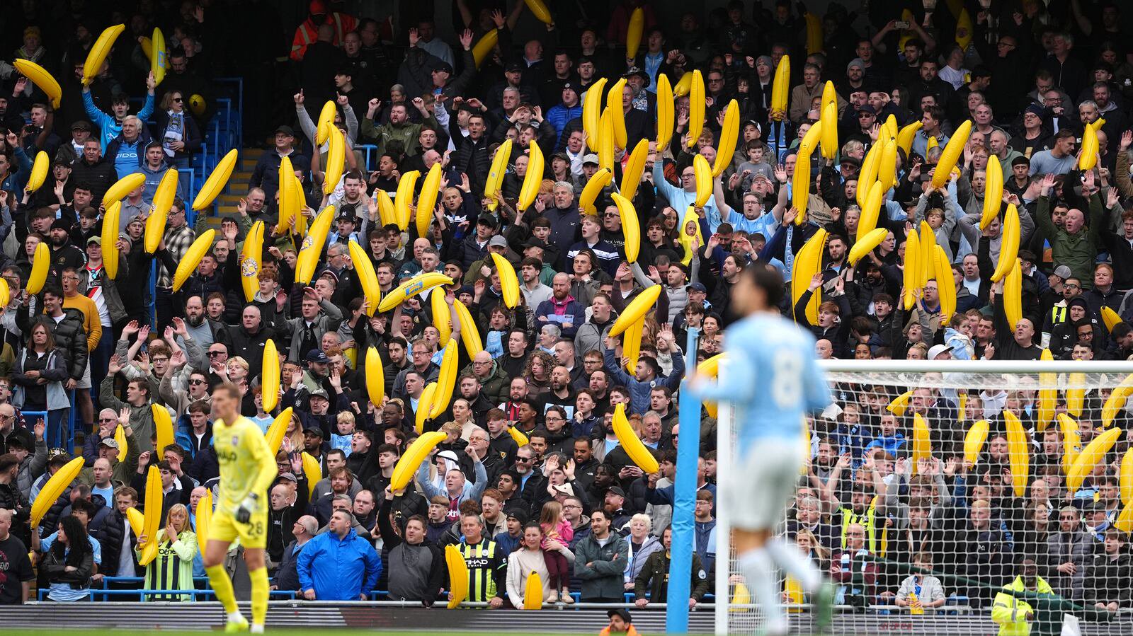 Manchester City fans with inflatable bananas in the stands against Ipswich