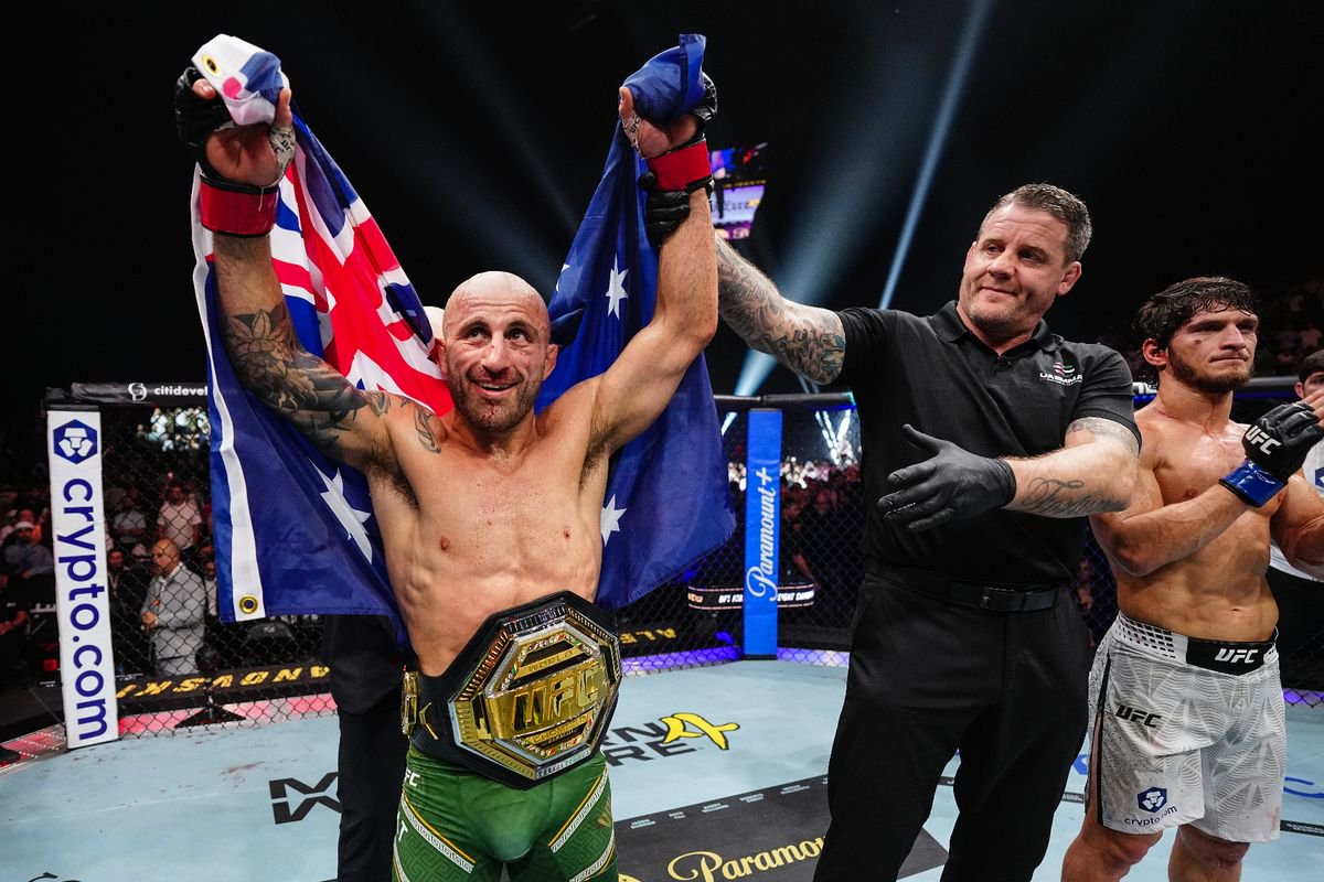 The featherweight champion gets his had raised after a record-setting ninth title defence