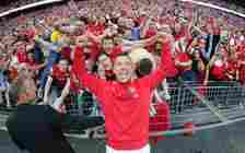 Lukas Podolski celebrates with the Arsenal fans after the FA Cup Final between Arsenal and Hull City at Wembley Stadium on May 17, 2014 in London, ...