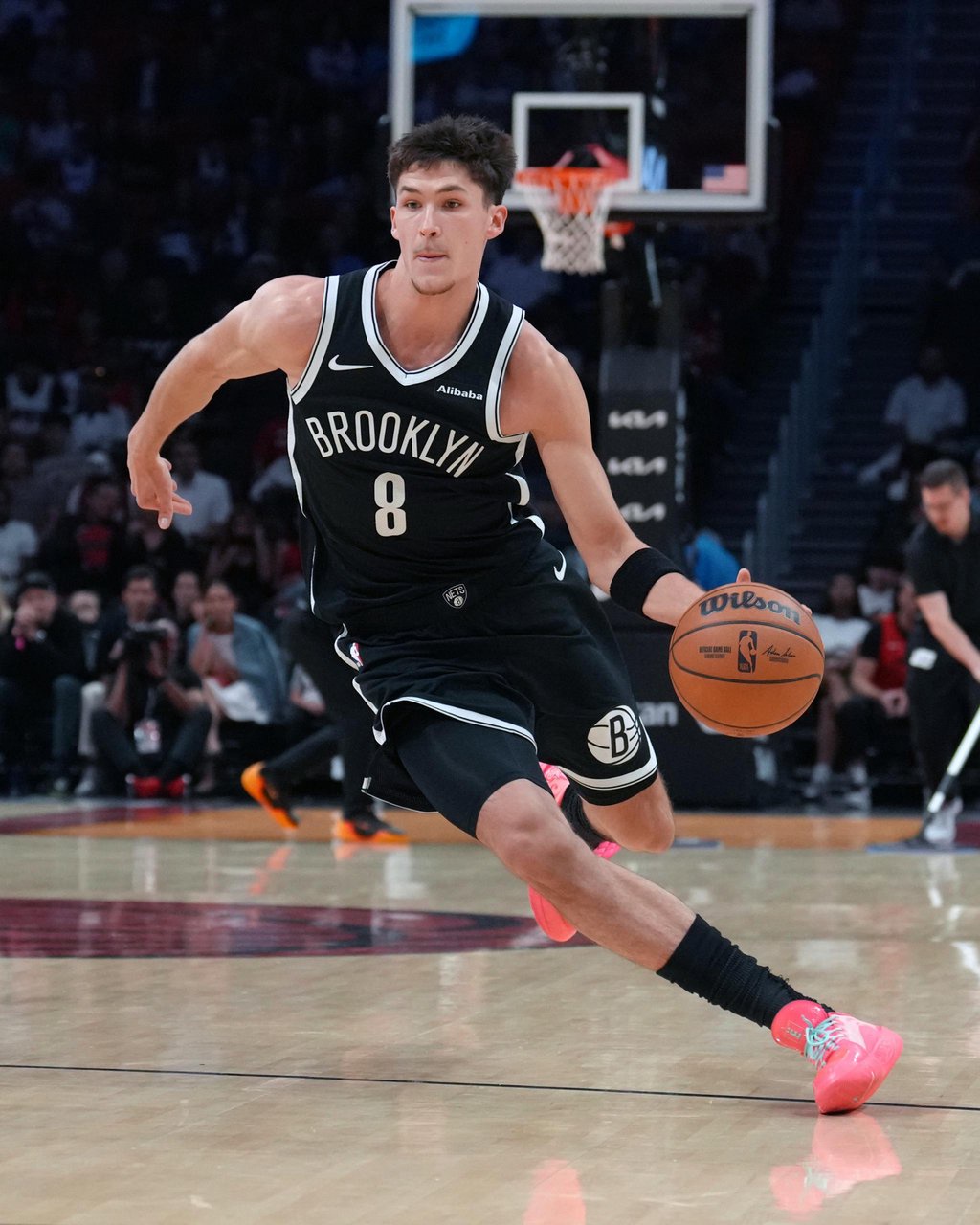 Brooklyn Nets' Egor Demin (8) dribbles the ball during a game against the Miami Heat.