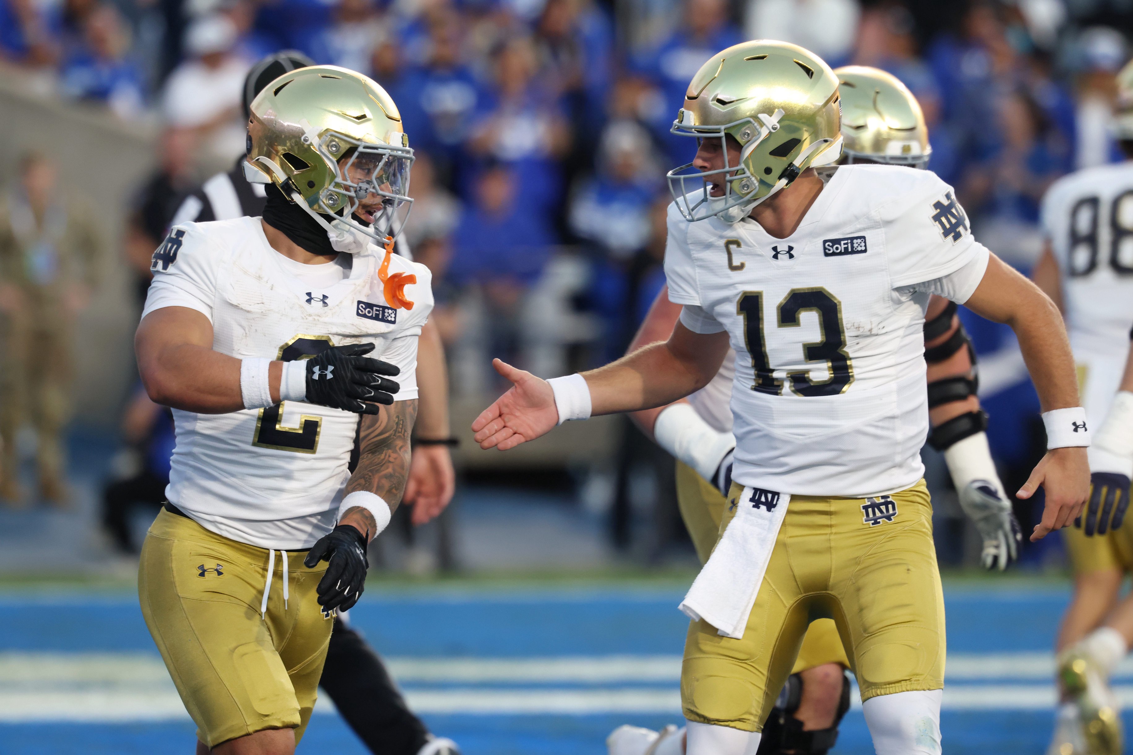Oct 17, 2026; Provo, Utah, USA;  Notre Dame Fighting Irish running back Nolan James Jr. (2) celebrates with quarterback CJ Carr (13) after scoring a touchdown against the Brigham Young Cougars during the first half at LaVell Edwards Stadium.  Mandatory Credit: Rob Gray-Imagn Images