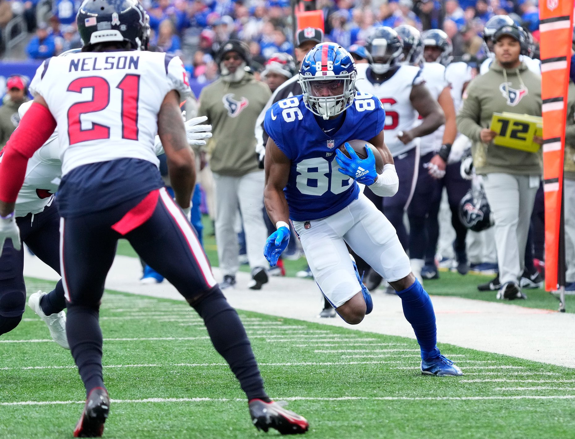 Nov 13, 2022; East Rutherford, NJ, USA; New York Giants wide receiver Darius Slayton (86) runs for a first down after a reception during the first quarter of a game against the Houston Texans at MetLife Stadium. Mandatory Credit: Robert Deutsch-USA TODAY Sports