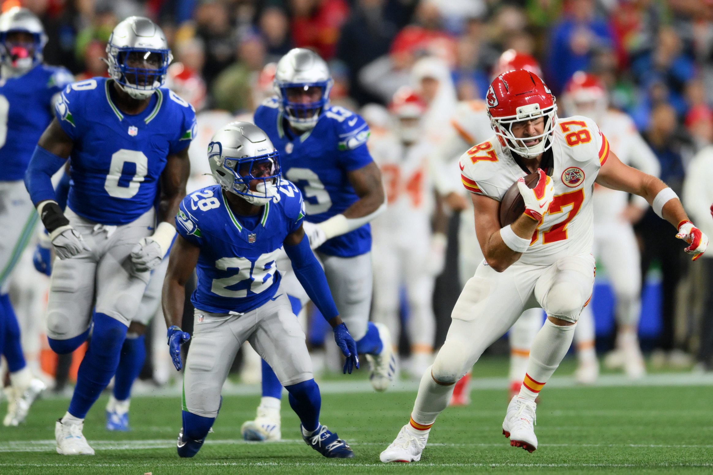Oct 25, 2026; Seattle, Washington, USA;  Kansas City Chiefs tight end Travis Kelce (87) carries the ball against the Seattle Seahawks during the third quarter at Lumen Field.  Mandatory Credit: Steven Bisig-Imagn Images