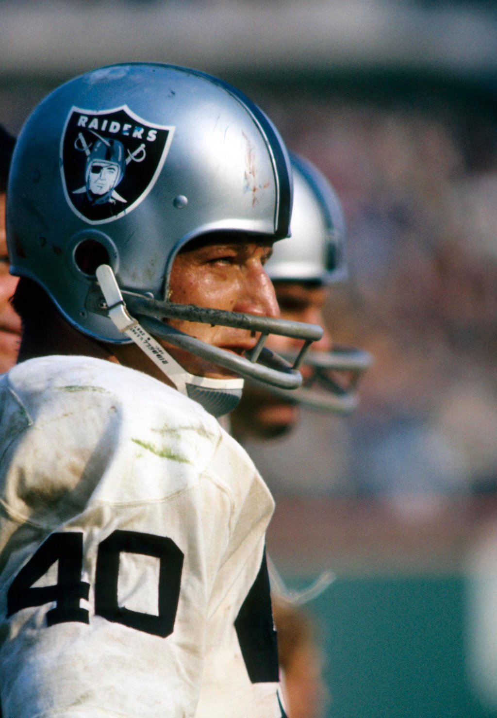 Oakland Raiders running back Pete Banaszak stands on the sideline.