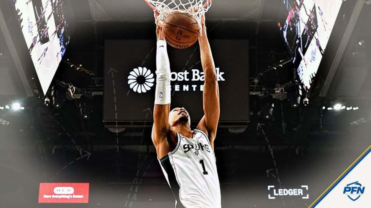 Victor Wembanyama's stunning self alley-oop against the Kings goes viral, drawing wild reactions from NBA fans and Adam Schefter.