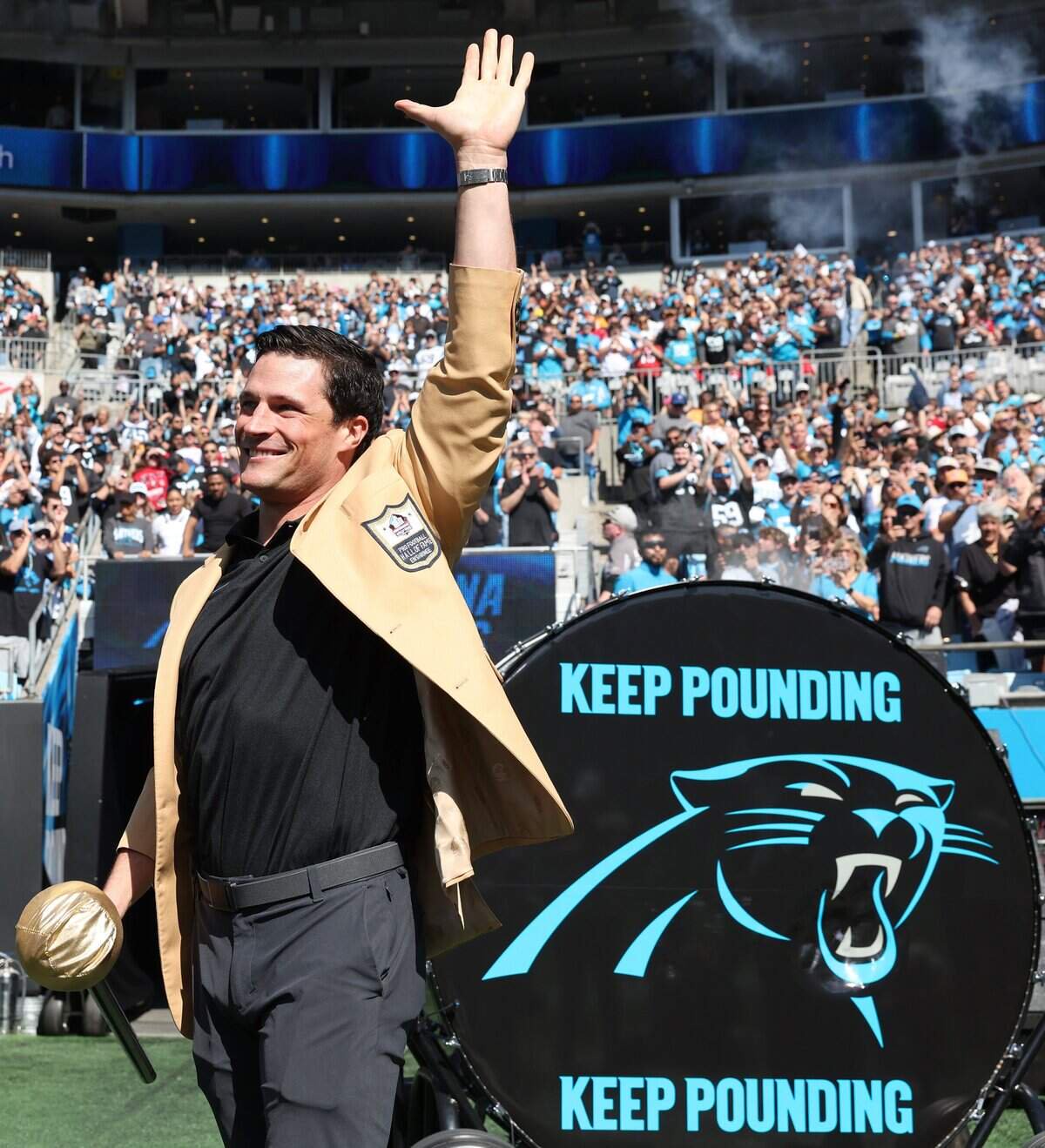 Former Carolina Panthers linebacker Luke Kuechly acknowledges the cheers of the fans after hitting the Keep Pounding drum prior to the team’s game against the Tampa Bay Buccaneers at Bank of America Stadium in Charlotte, NC on Sunday, October 25, 2026.