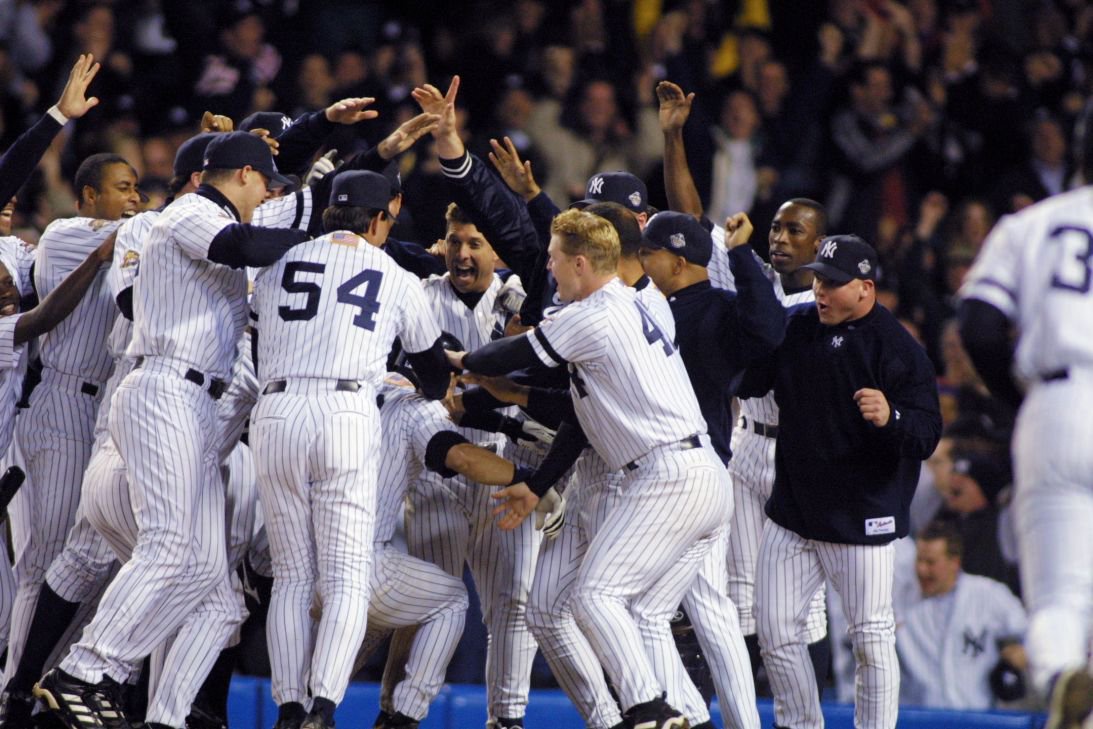 Jeter celebrates with his team after hitting a game-winning home run in the 11th inning of Game 4 of the 2001 World Series.