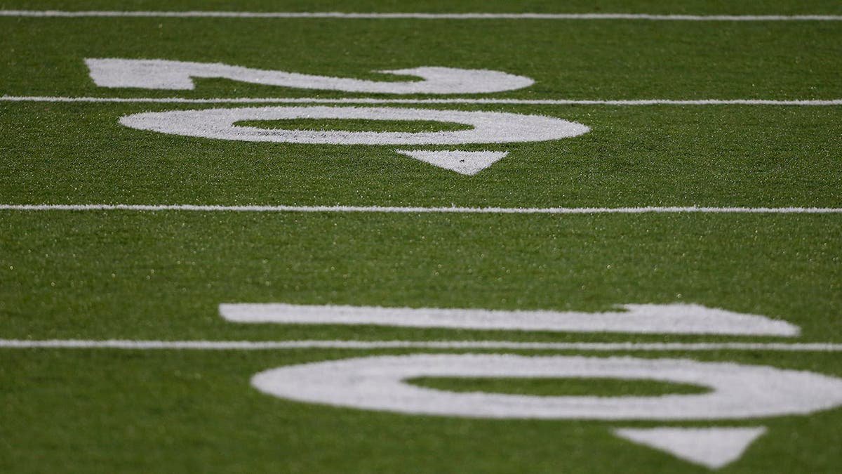 Liberty Flames turf field painted with numbers at Williams Stadium.