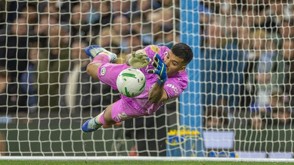Geronimo Rulli of Manchester City saves a penalty during the Carabao Cup Round of 16 match between Manchester City and Brighton