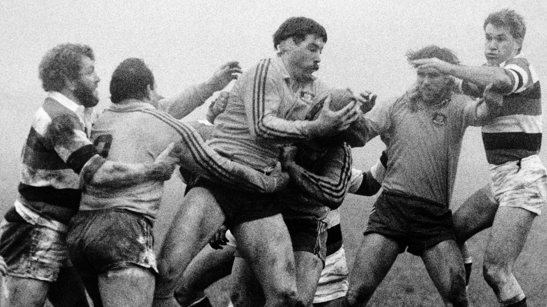 Black and white image shows David Codey of Australia get the line out ball with Graham Price and Eddie Butler closing in