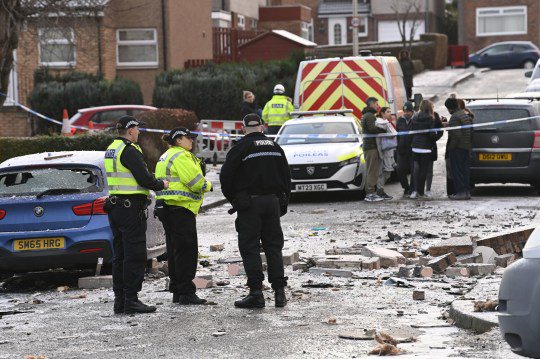 Police officers at the scene on Baberton Mains Avenue, Edinburgh, after an 84-year-old man died following an explosion at a house on Friday night.  Picture date: Saturday December 2, 2023. PA Photo.  See PA story POLICE Explosion.  Photo credit should be as follows: Lesley Martin/PA Wire