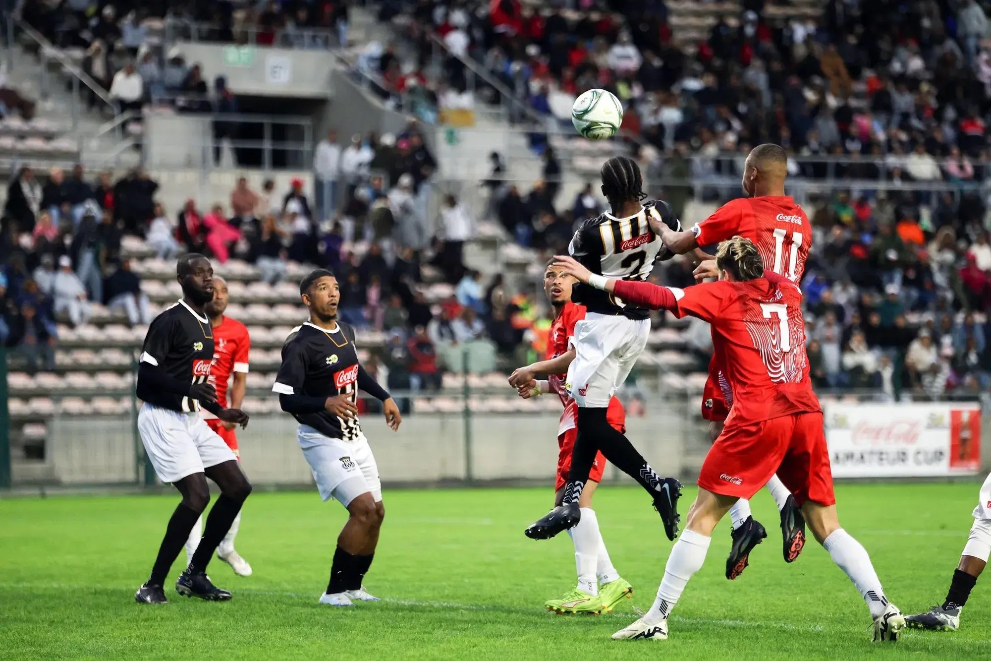 Aerial battle… Saxon Rovers’ Leroy Coelho poses a threat in the air during his side’s Coke Cup final against Hanover Park at Athlone Stadium on Saturday.