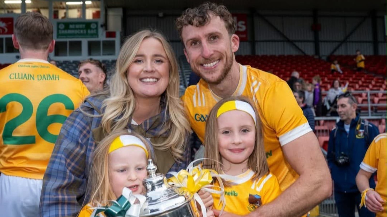 Barry O'Hagan, wife Aoife and daughters Ada and Riognach with the Frank O'Hare Cup after Clonduff's Down SFC triumph