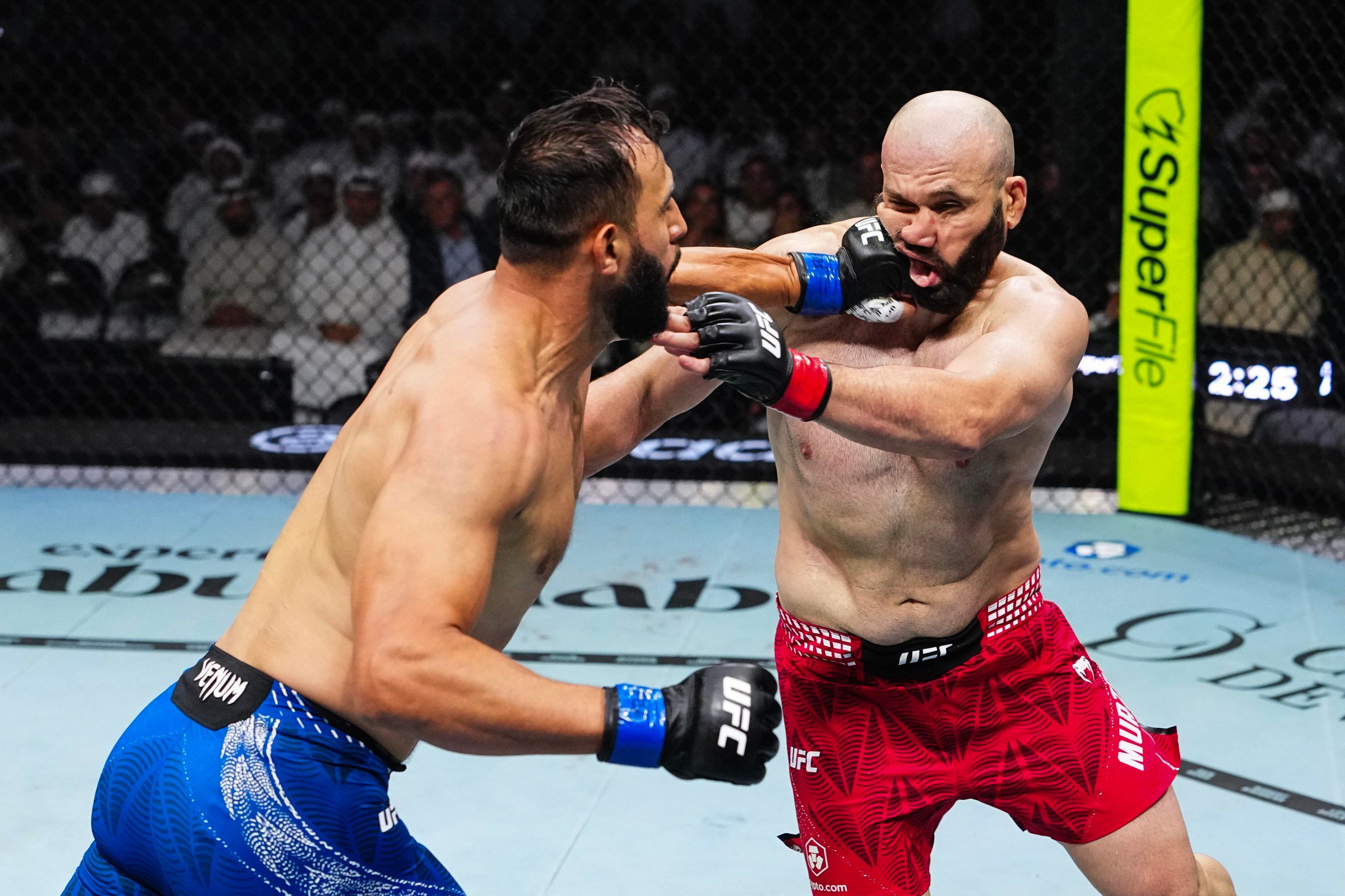 ABU DHABI, UNITED ARAB EMIRATES - OCTOBER 24: (L-R) Dominick Reyes punches Azamat Murzakanov of Russia in a light heavyweight fight during the UFC 333 event at Etihad Arena on October 24, 2026 in Abu Dhabi, United Arab Emirates. (Photo by Jeff Bottari/Zuffa LLC)
