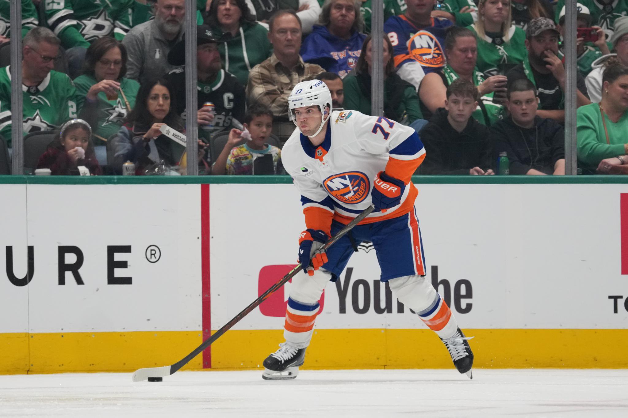 Tony DeAngelo of the New York Islanders handles the puck on the ice during a game against the Dallas Stars.