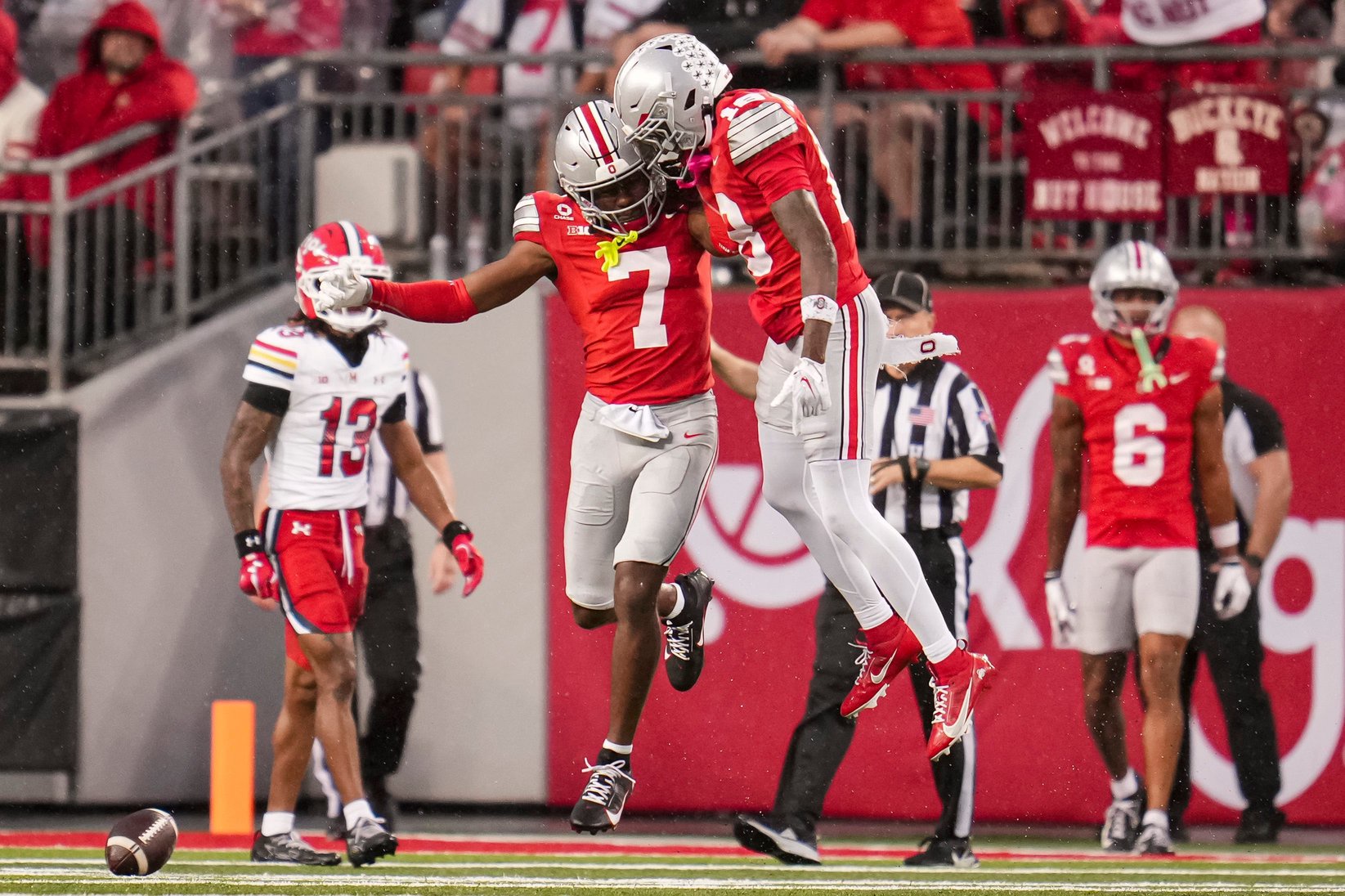 Ohio State Buckeyes cornerback Jermaine Mathews Jr. (7) celebrates with defensive back Cam Calhoun (18) during the NCAA football game against the Maryland Terrapins at Ohio Stadium in Columbus on Oct. 10, 2026.