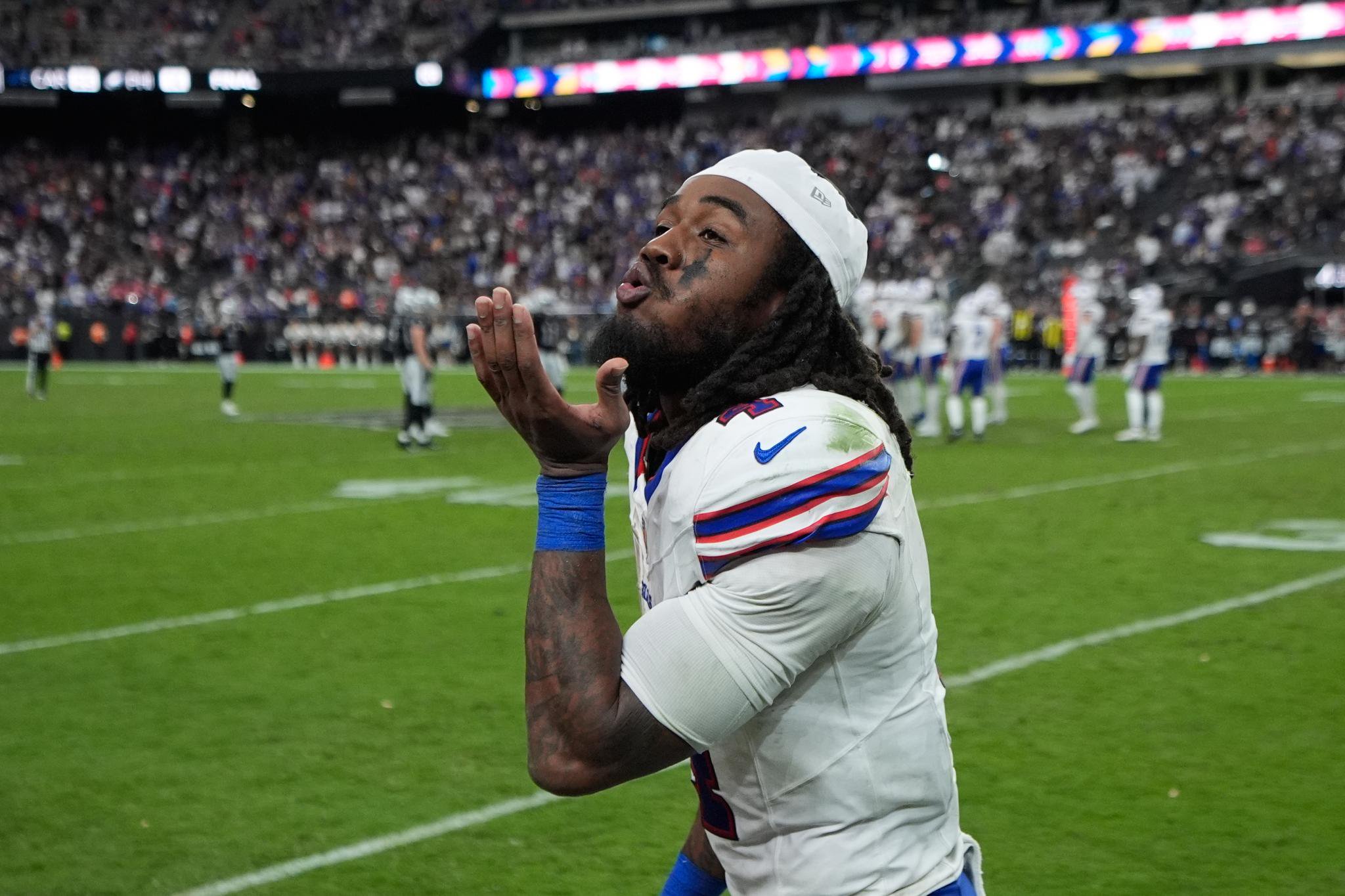 Buffalo Bills running back James Cook III celebrates on the field.