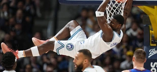 McDaniels, Edwards lead surging Timberwolves past Nuggets 111-98 and into 1st-place tie in West