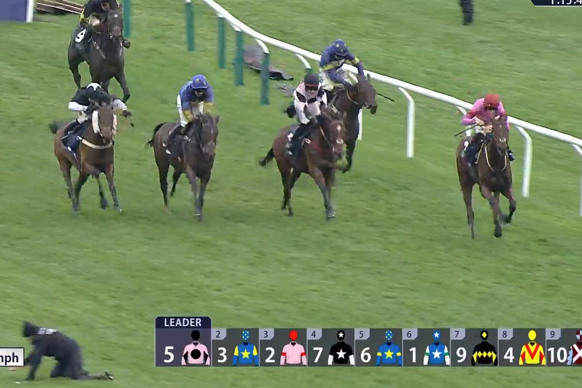 The man could be seen on his hands and knees in the Racing TV footage 