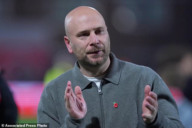 Fleetwood's coach Matt Lawlor celebrates after winning a penalty shootout during the English League Cup soccer match between Fleetwood Town and Arsenal in Fleetwood, England, Tuesday, Oct. 27, 2026. (AP Photo/Ian Hodgson)