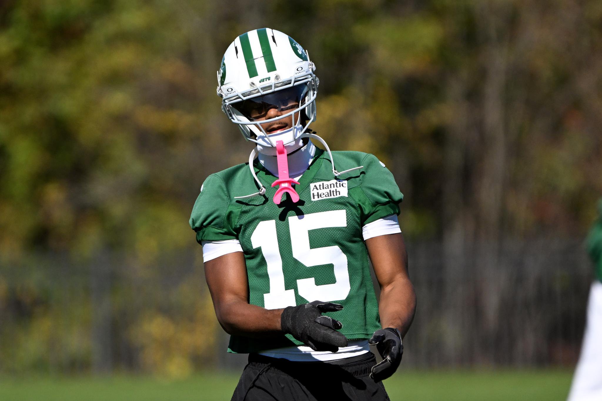New York Jets wide receiver Adonai Mitchell (15) stretches during practice.