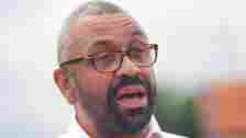 PA James Cleverly in a shirt and glasses