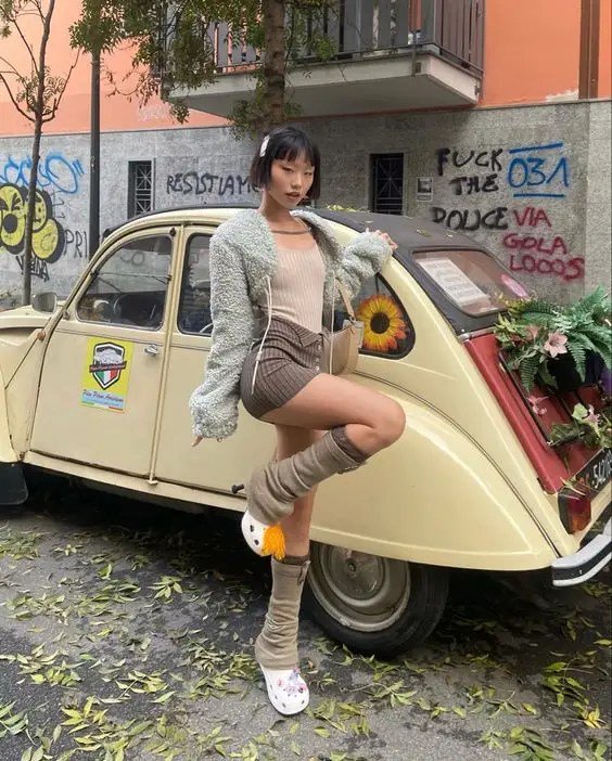 An Asian girl wearing high-heeled crocs