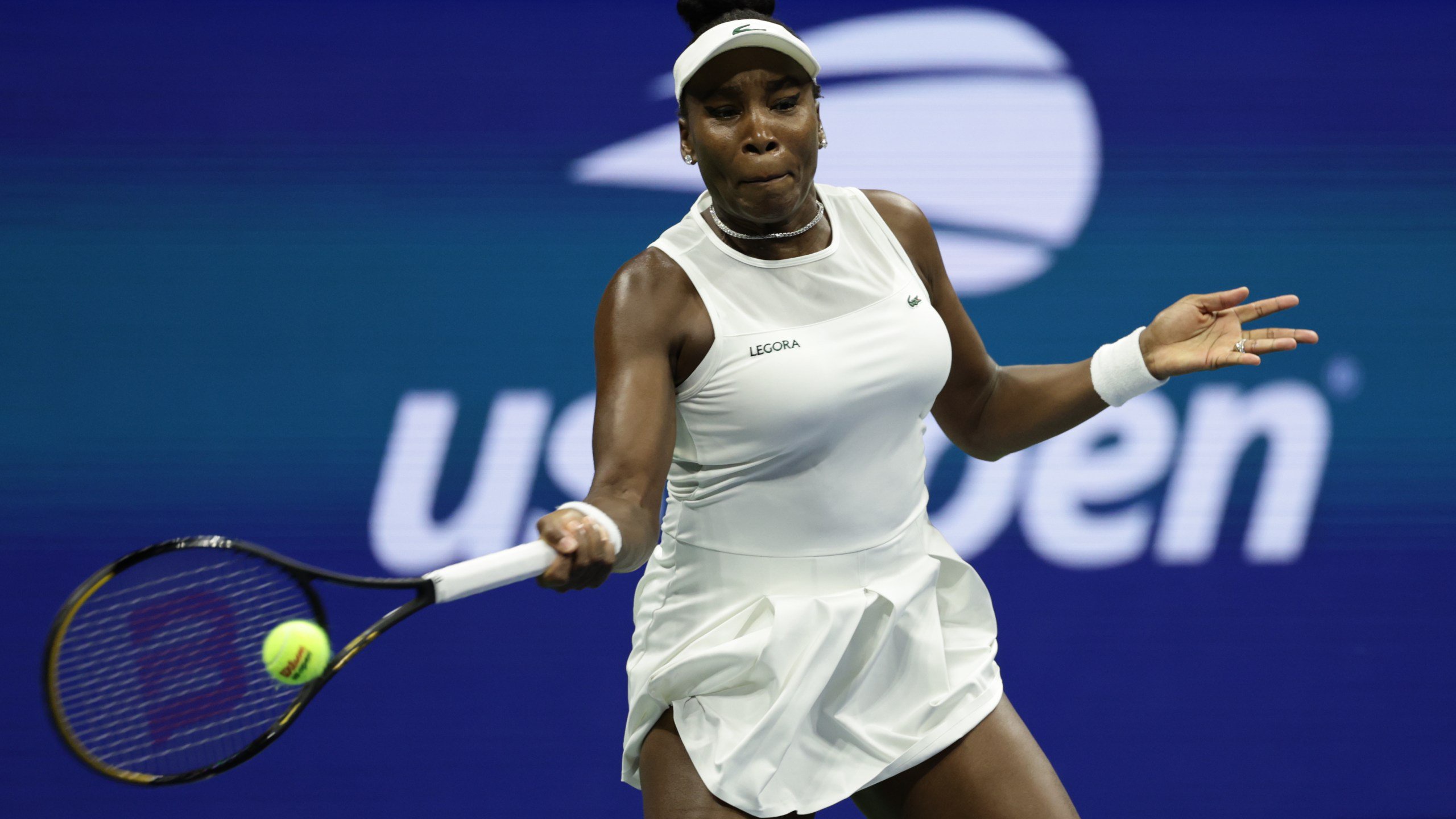 FILE - Venus Williams, of the United States, hits a return as she plays a women's doubles match with partner Serena Williams against Hao-Ching Chan, of Taiwan, and Maya Joint, at the U.S. Open tennis championships, Friday, Sept. 4, 2026, in New York. (AP Photo/Adam Hunger, File)