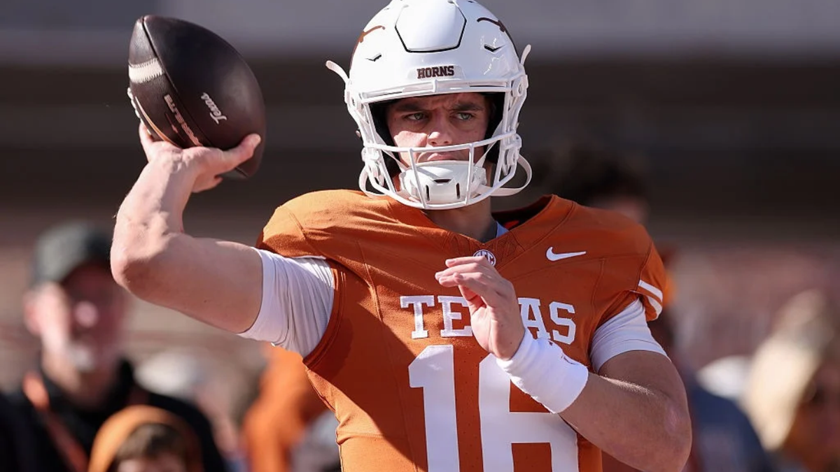 Arch Manning warms up before a game at Darrell K Royal-Texas Memorial Stadium.