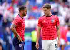 Kyle Walker interacts with John Stones of England during the warm up prior to the UEFA EURO 2024 round of 16 match between England and Slovakia at ...