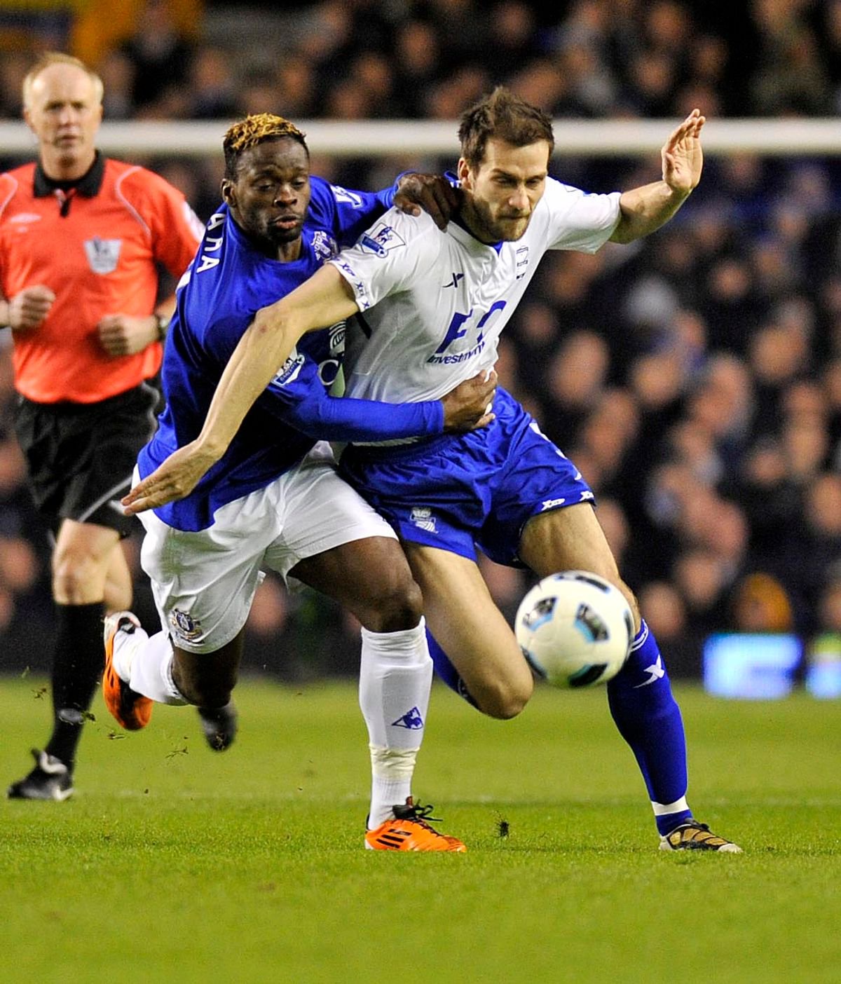 Louis Saha goes up against Roger Johnson of Birmingham City