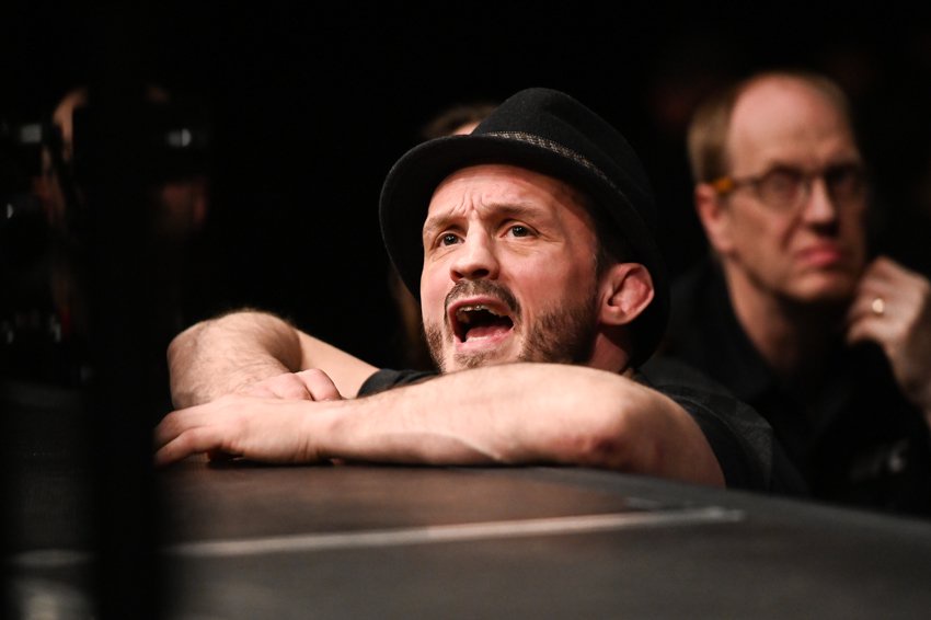 Brad Pickett watching a fight from the ringside at UFC London.