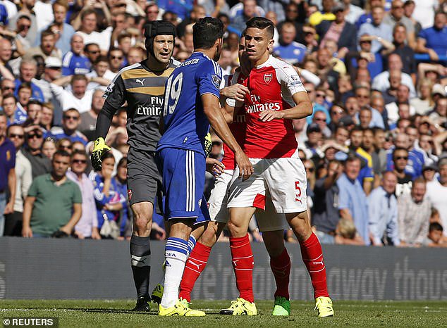 Costa (middle) was the protagonist in getting Arsenal's Gabriel Paulista sent off in 2015