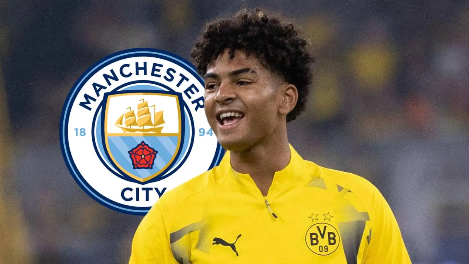 Borussia Dortmund star Mathis Albert with a Man City badge