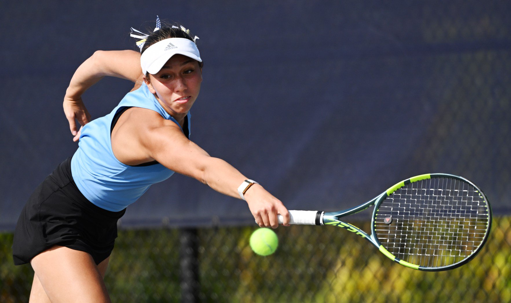 Sandburg’s Estela Loureiro hustles to keep the ball in play during the Class 2A girls tennis state championship match in Buffalo Grove on Saturday, Oct. 24, 2026. (Joe Lewnard / Daily Herald)