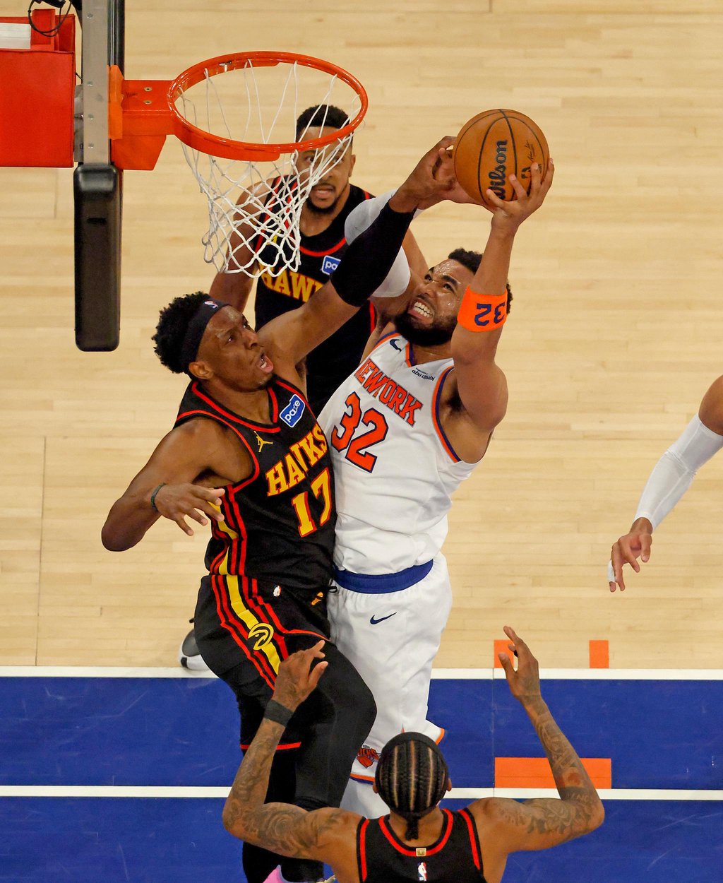 New York Knicks center Karl-Anthony Towns (32) goes up for a shot against Atlanta Hawks defenders during Game 1 of the NBA playoffs.