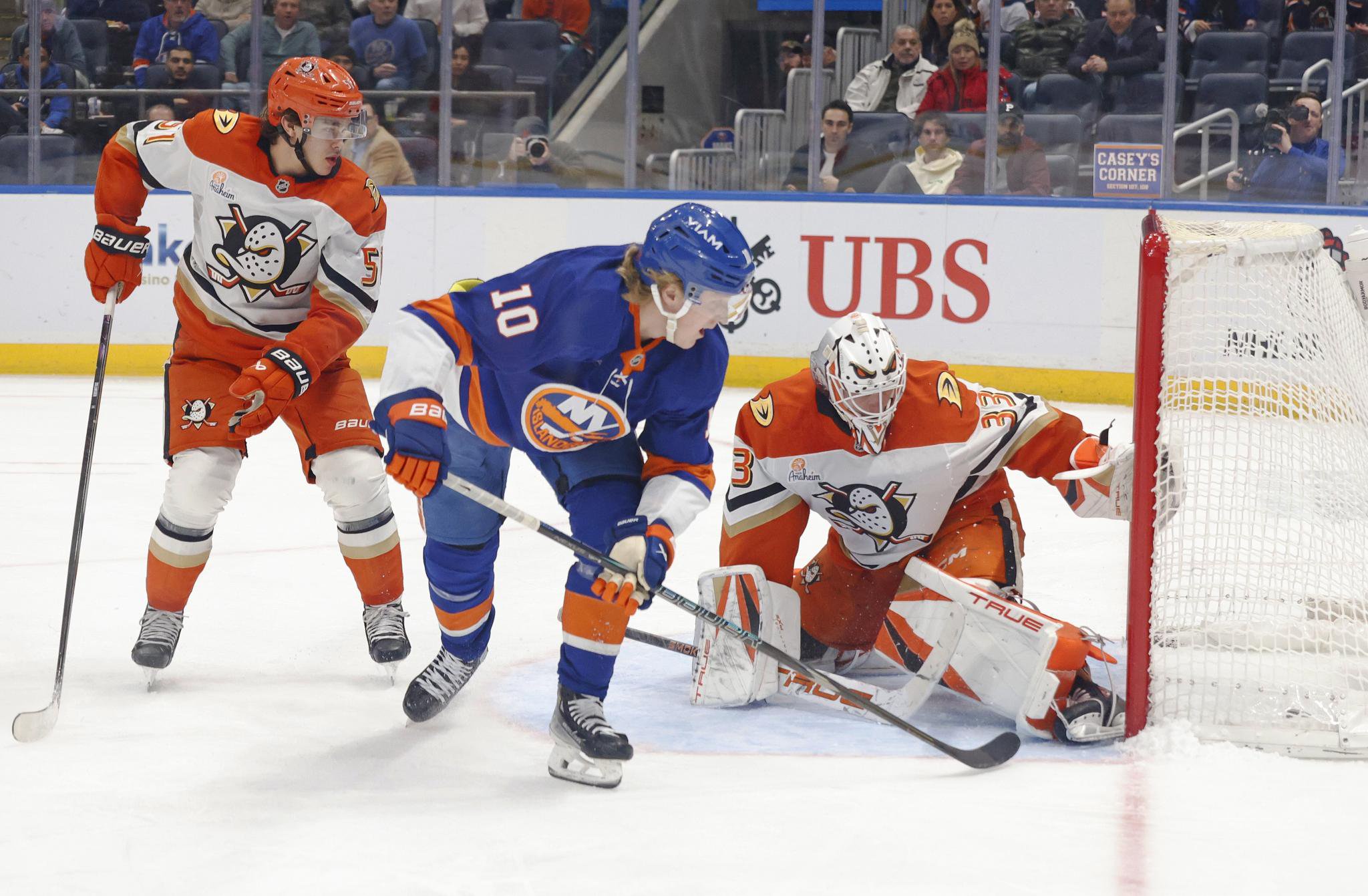 Simon Holmstrom scores a goal on Ville Husso during the Islanders' win over the Ducks. 