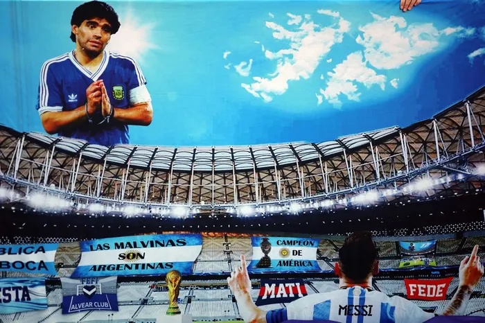 As Lionel Messi and Cristiano Ronaldo reach the end of their international careers, Rodney Reiners explains why Diego Maradona remains the ultimate football god.  |  AFP