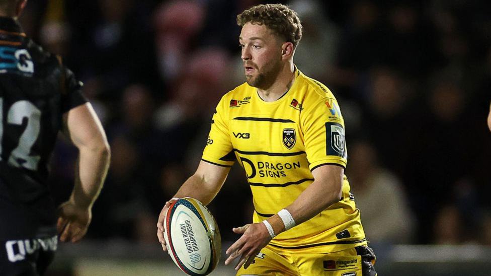 Angus O'Brien with the ball in his hands for Dragons