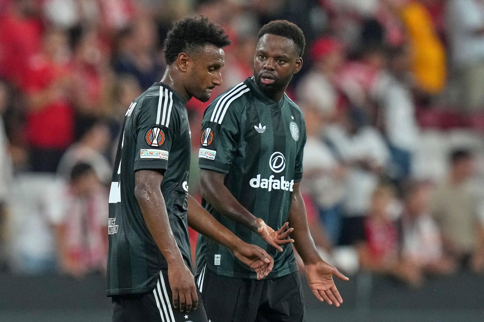 Celtic's Jordan Lotomba and Haissem Hassan react after the Europa League defeat to Benfica in Lisbon