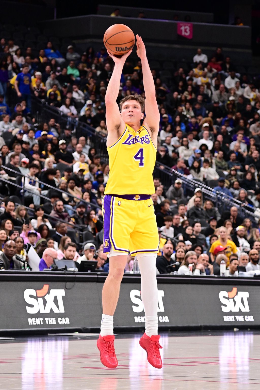 Dalton Knecht #4 of the Los Angeles Lakers shoots a three point basket during the game against the Golden State Warriors on October 13, 2026 at Crypto.Com Arena in Los Angeles, California. 