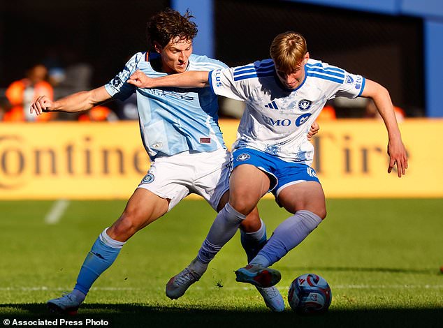New York City FC defender Nico Cavallo, left, battles CF Montréal midfielder Hennadii Synchuk, right, for the ball during the second half of an MLS soccer match, Saturday, Oct. 31, 2026, in New York. (AP Photo/Noah K. Murray)