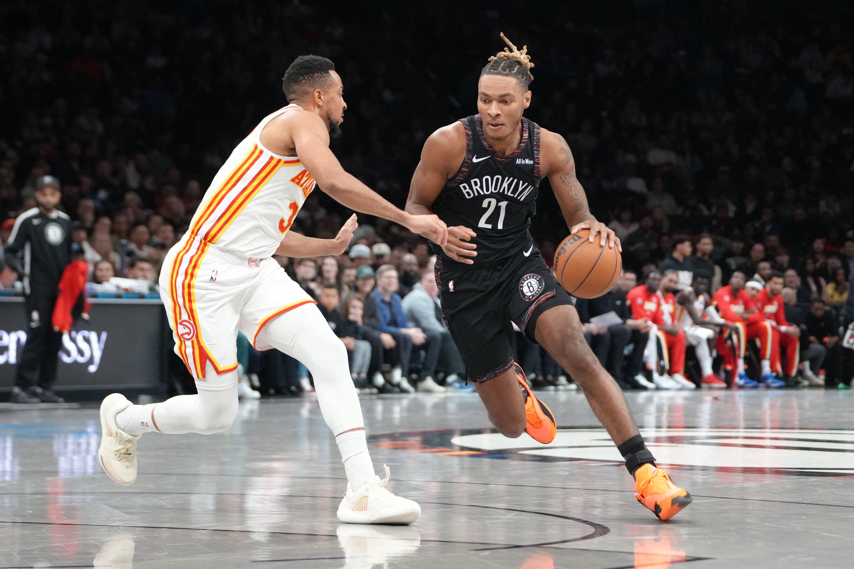 Apr 3, 2026; Brooklyn, New York, USA; Brooklyn Nets forward Noah Clowney (21) dribbles the ball against Atlanta Hawks guard CJ McCollum (3) during the first half at Barclays Center. Mandatory Credit: Gregory Fisher-Imagn Images